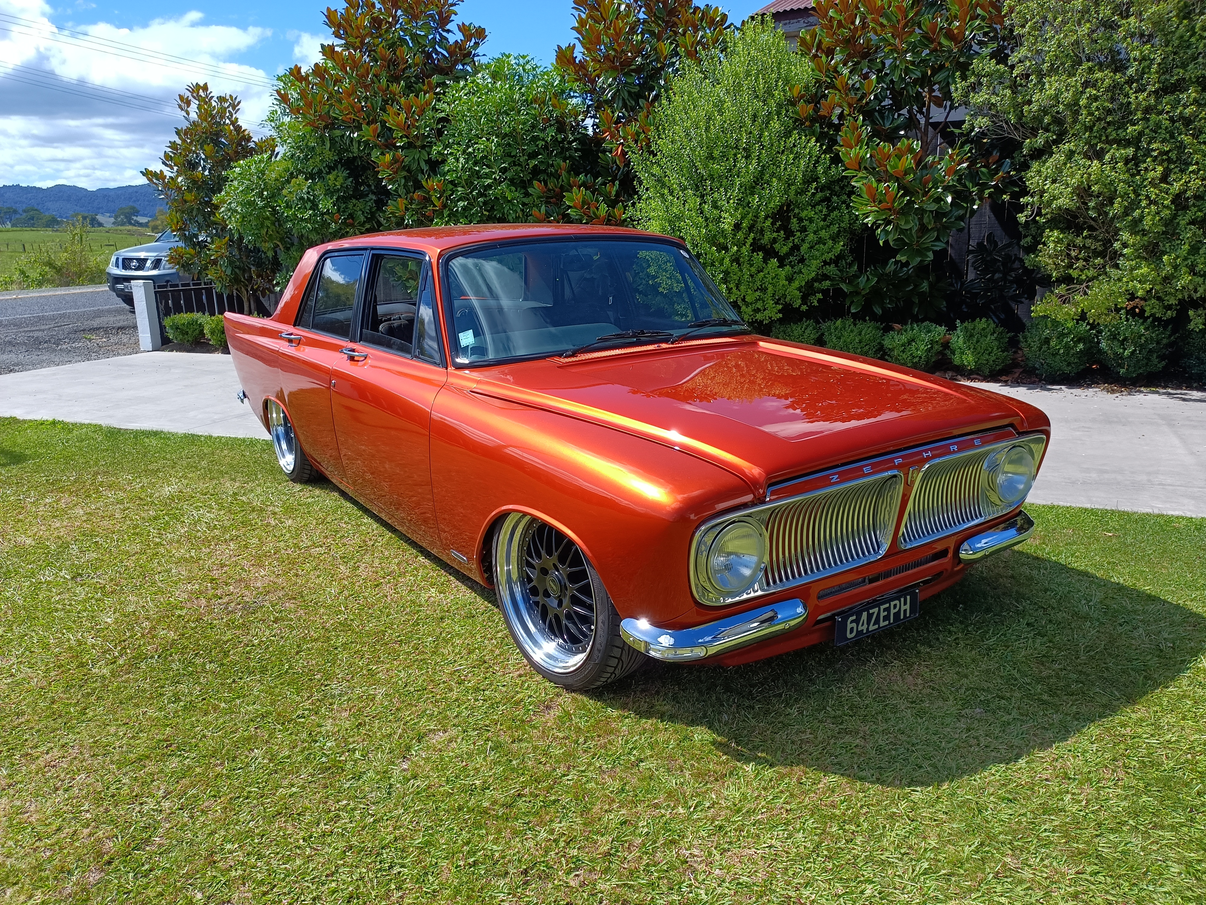 Orange 1964 Ford Zephyr sitting on grass