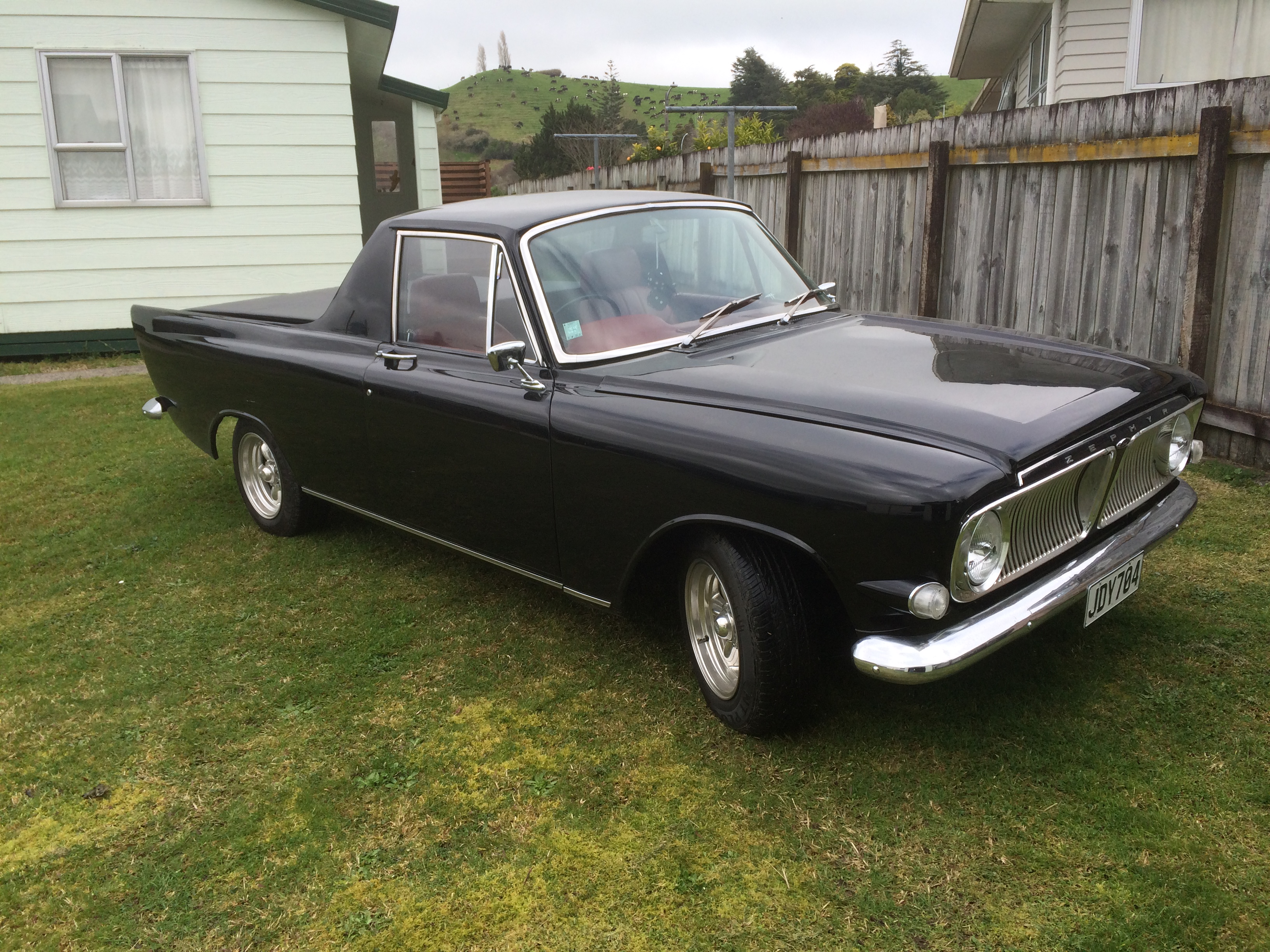 Jet Black 1965 Ford Zephyr Custom Ute sitting on grass